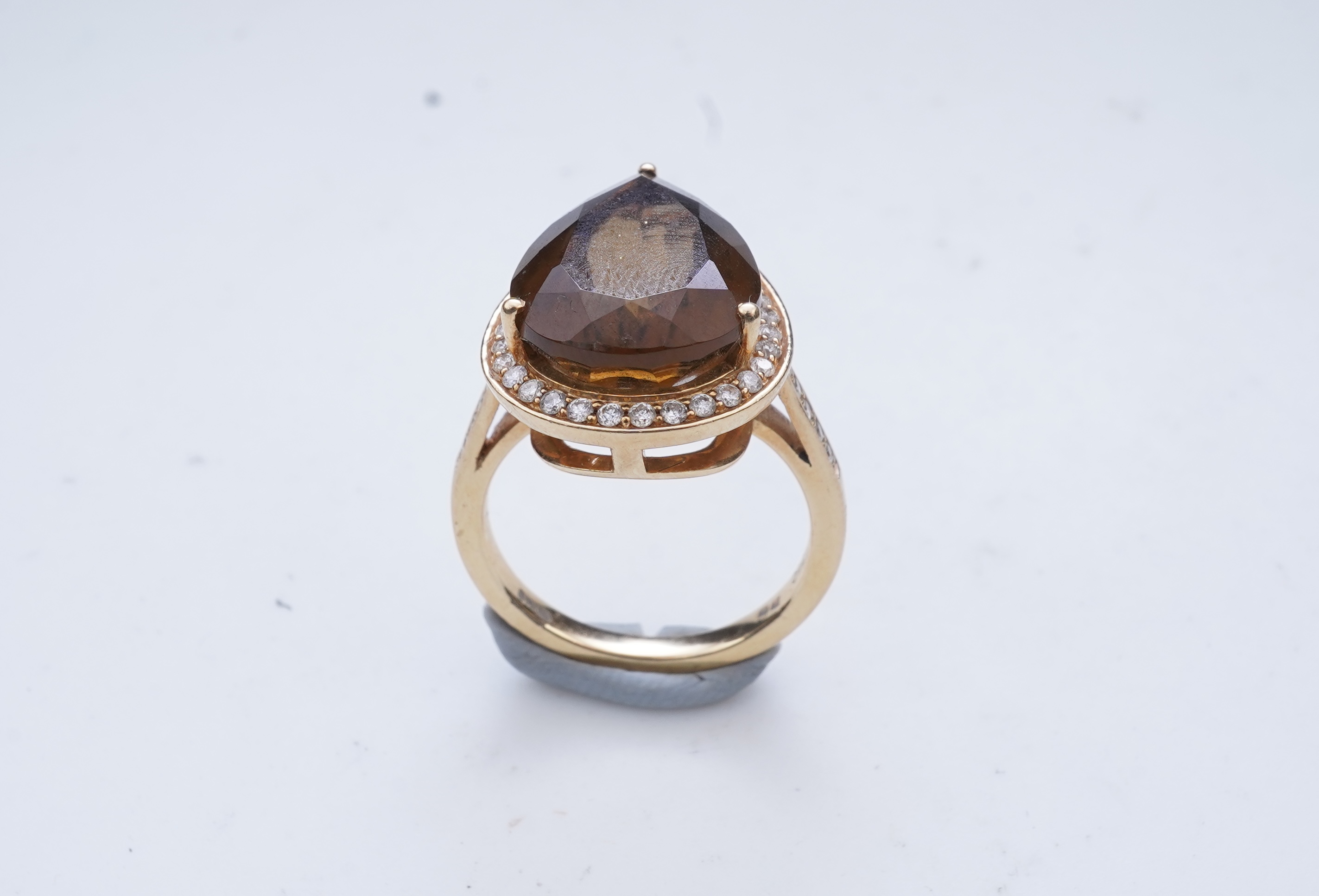 A smoky quartz and diamond ring